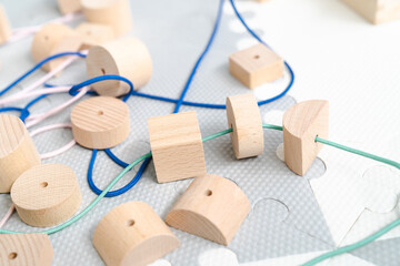 Sensory integration therapy - wooden geometric beads for stringing for preeschool (close up picture)