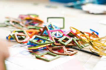 Sensory integration therapy - child constructing objects from colorful geometric magnetic elements (close up picture)