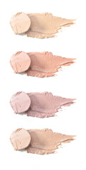 Set of creamy neutral toned makeup samples on white background	