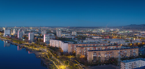 Panorama of the Siberian city of Krasnoyarsk. Evening top view. Right Bank and Yenisei River