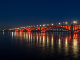 Siberian city of Krasnoyarsk. Night view of the Yenisei River. Communal bridge