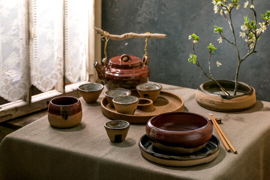 Asian style table setting with craft tableware