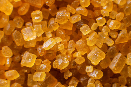 Extreme macro crystals of cane sugar. Abstract sugar background close-up in shallow depth of focus