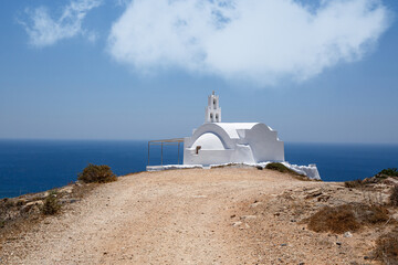 Traditional Greek white church on the seashore.