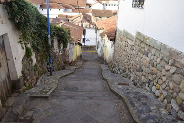 Cusco street with beautiful ancient architecture. Cobbled street of the old city of Cusco