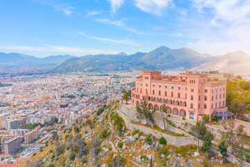 Castle on the rock and panoramic view of the city in the valley, aerial view.