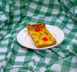 PIECE OF APPLE PIE ON A WHITE PLATE