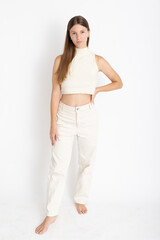 Naklejka premium Young Woman dressing white on photo studio shooting - Confidence