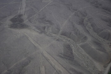 Mysterious figures Nazca desert from the aircraft. Nazca plateau, Peru
