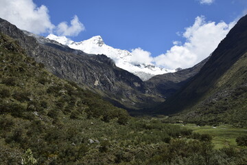 Fototapeta na wymiar Trekking in Laguna 69, Snow-capped mountains on the way to the Lagoon 69, Peru