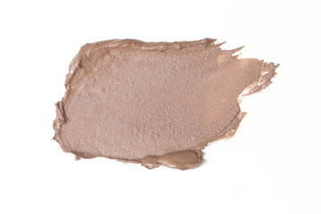 Creamy neutral toned makeup sample on white background	