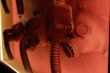 Old antigas respirators on display at red light in studio