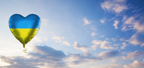 Blue and yellow balloon on perfect day sky background. Ukraine and Ukrainian concept