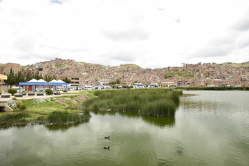 The coast of Lake Titicaca overlooking the city of Puno, Peru