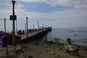 HUANCHACO, PERU. Historic iron pier 108 metres in length at Huanchaco on the coast of northern Peru.