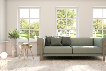 White living room with sofa and summer landscape in window. Scandinavian interior design. 3D illustration