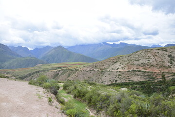 Fototapeta na wymiar The road between the mountains to the salt terraces of Maras in the Andes mountain range in the region of Cusco, Peru
