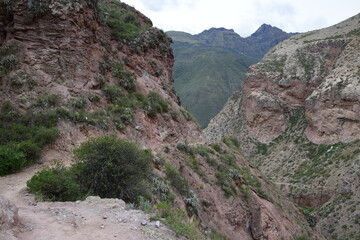 The road between the mountains to the salt terraces of Maras in the Andes mountain range in the region of Cusco, Peru