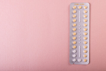 Directly above shot of medicine blister pack isolated over pink background, copy space