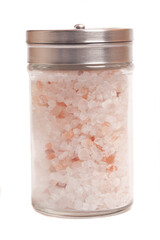 Pink Himalayan salt crystals in a glass grinder isolated on white background