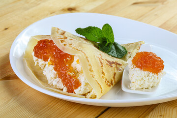 Pancake with cottage cheese and jam