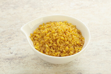 Raw bulgur in the bowl