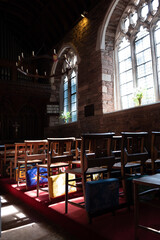 Embroided Prayer Cushions On The Back Of Wooden Chairs At Cockington Court Church, Devon