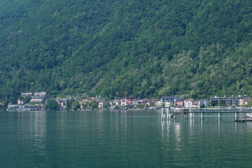 Fototapeta na wymiar La cittadina di Melide vista dal Ponte Diga sul lago Ceresio.