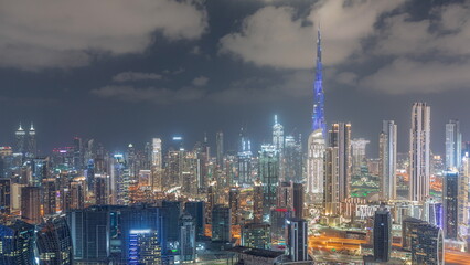 Fototapeta na wymiar Panoramic skyline of Dubai with business bay and downtown district night timelapse.