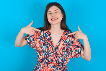 Pick me! Confident, self-assured and charismatic young caucasian woman wearing floral dress over...