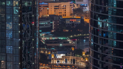 Aerial view of Dubai Internet City Lake and Buildings night timelapse