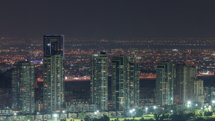 Aerial view of greens district area night timelapse from Dubai marina.