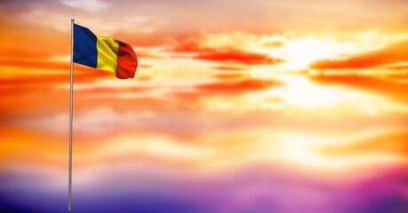 Composite image of waving romania flag against sunset sky in background