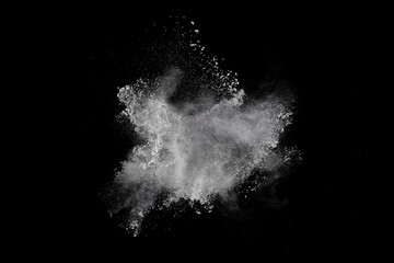 White powder explosion on black background. Colored cloud. Colorful dust explode. Paint Holi.