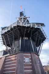 Molen de Adriaan is a smocked windmill that sits on the scenic Spaarne River in central Haarlem. Molen de Adriaan originally built in 1779. Haarlem, North Holland, the Netherlands.