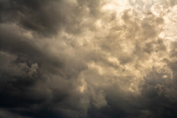 dramatic mystical sky with dense clouds and back sunlight. artistic picture for the original...