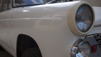 Front fender of a white retro car close-up, Cuba, Havana
