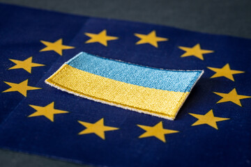 The concept of Ukraine joining the European Union, the Ukrainian flag lying in the middle of the EU...