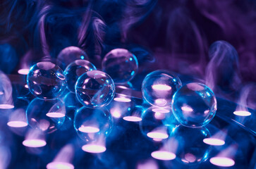 Abstract background in blue-violet tones with transparent balls