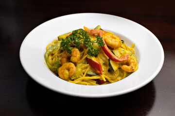 curry pasta with vegetables and shrimps