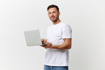 Happy tanned handsome man in basic t-shirt chatting with friends by laptop look at camera posing...