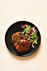 Roasted pork steak with salad from fresh vegetable