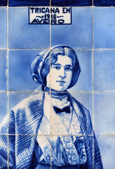 detail of an aristocrat on a panel of azulejos tiles on the facade of old railways station in Aveiro, Portugal	
