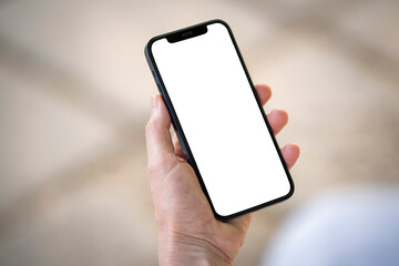 Old man holding new smartphone with blank screen concept