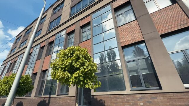 Office building facade exterior. Low angle view. Extreme wide shot