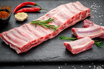 raw pork ribs on a stone background