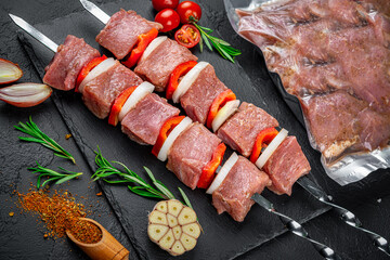 Vacuum-packed grilled meat, on a dark background.