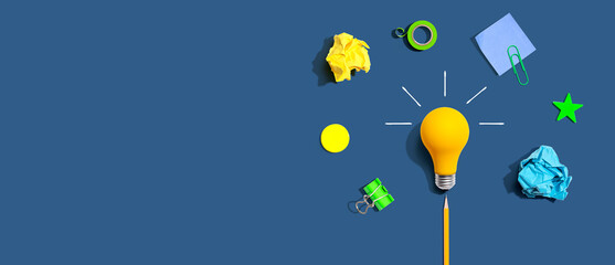 Fototapeta Brainstorming concept with a light bulb and school supplies obraz