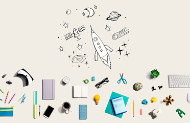 Dream of space and rocket with collection of electronic gadgets and office supplies