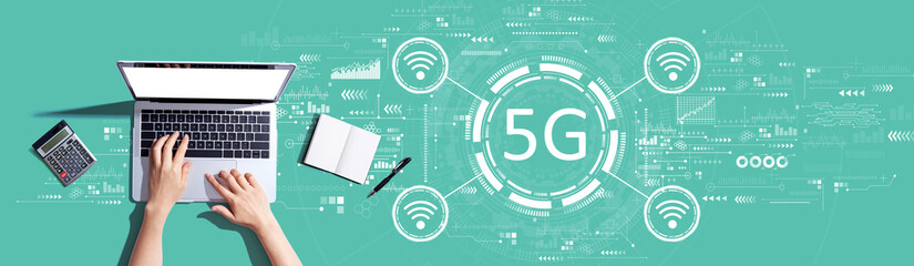 5G network with person using a laptop computer